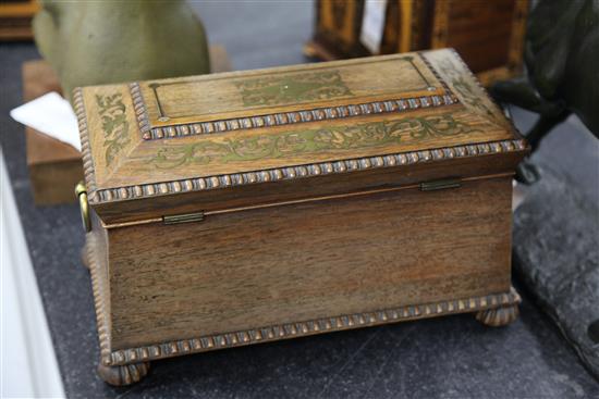 A Regency rosewood and brass inlaid sarcophagus shaped tea caddy, 13.75in.